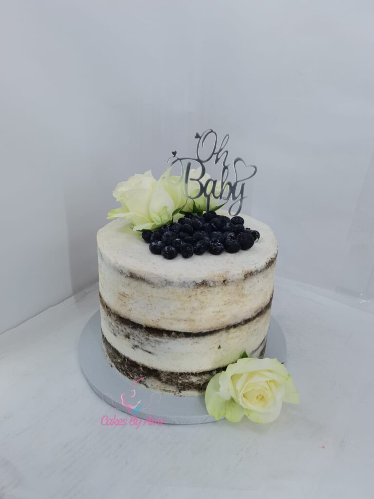 Semi-naked Oh Baby cake with blueberries and roses