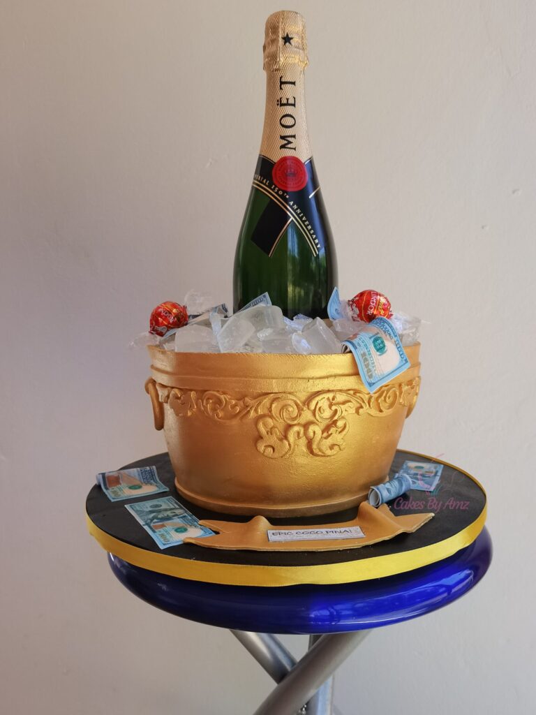 Gold champagne bucket cake with Moët bottle