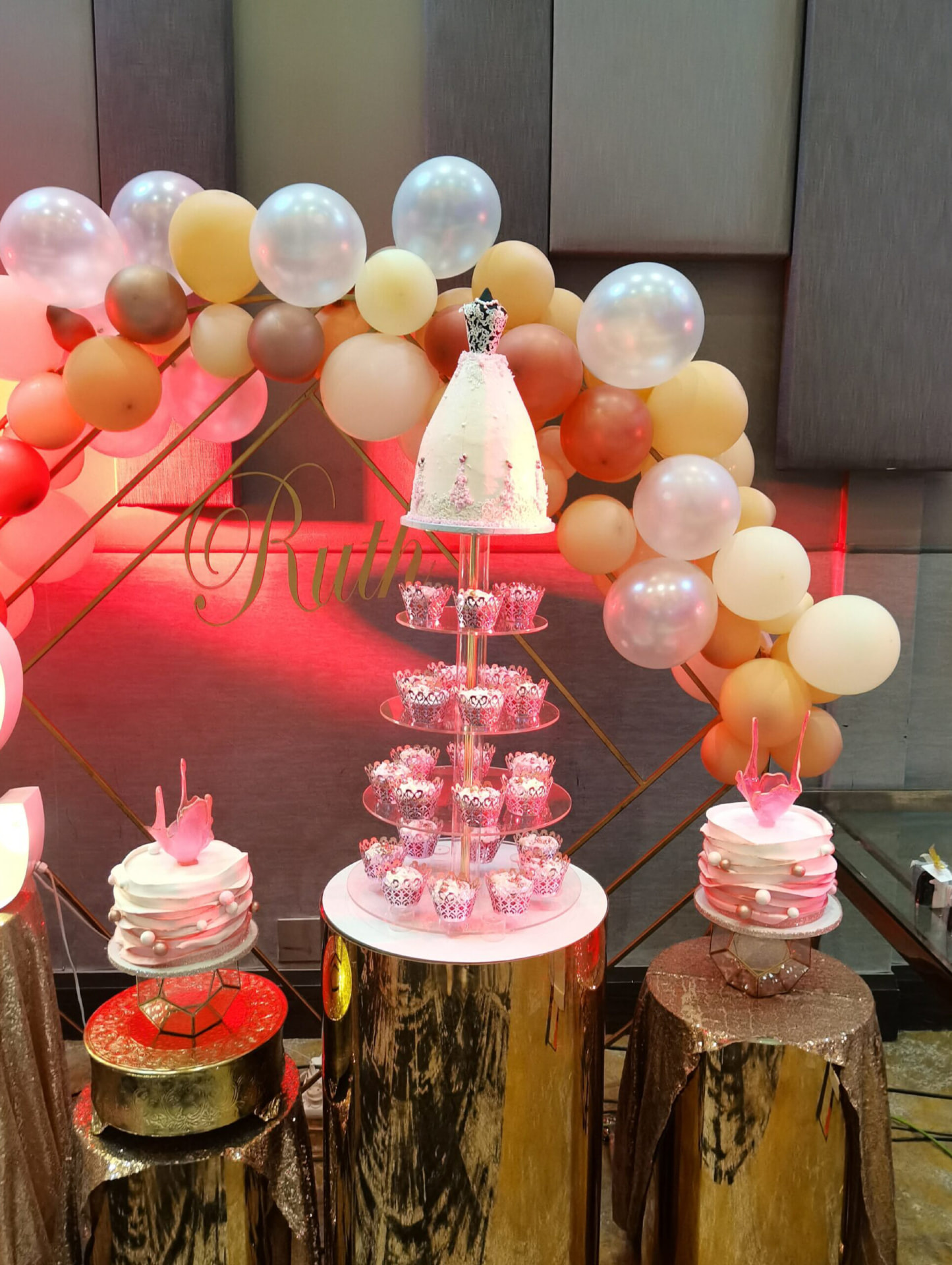 Styled Cakes By Amz dessert table with cupcake tower and balloon arch